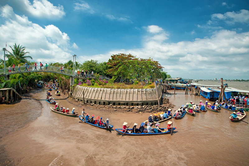 Explore an authentic river life and enjoy a lesser-seen side of Mekong Delta on a small wooden boat (xuồng).